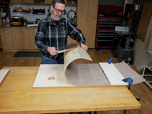 Clamping veneer sheet to plywood panel