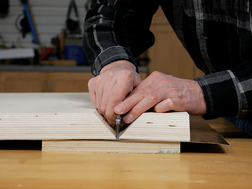 Cutting waterfall portion of veneer on desk wing