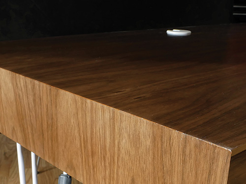 Close-up of waterfall desk veneered corner